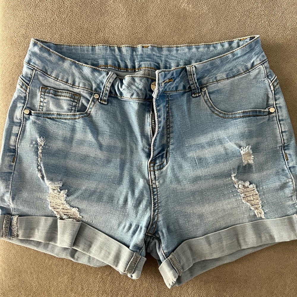 Stretchy light washed distressed shorts.